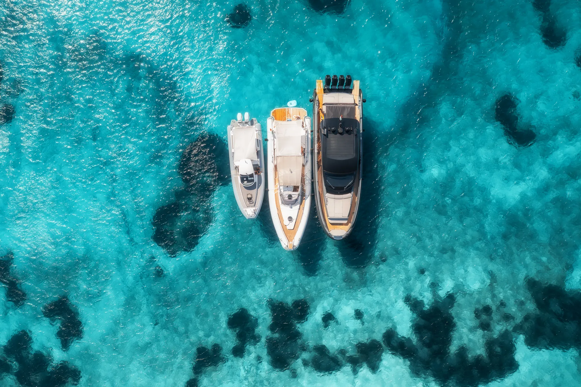 Aerial view of three yachts