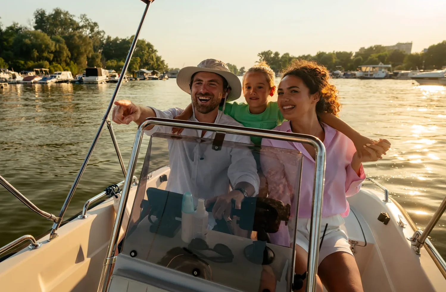 Family enjoying a boat ride on a sunset